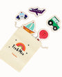 Set of colorful wooden vehicle toys with a 'Tix & Mix' pouch on a white background