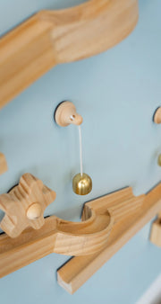 A Tix&Mix marble track on a blue dream magnetic wall decal.
