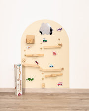 A Tix&Mix marble track product placed on a magnetic wall decal for kids.