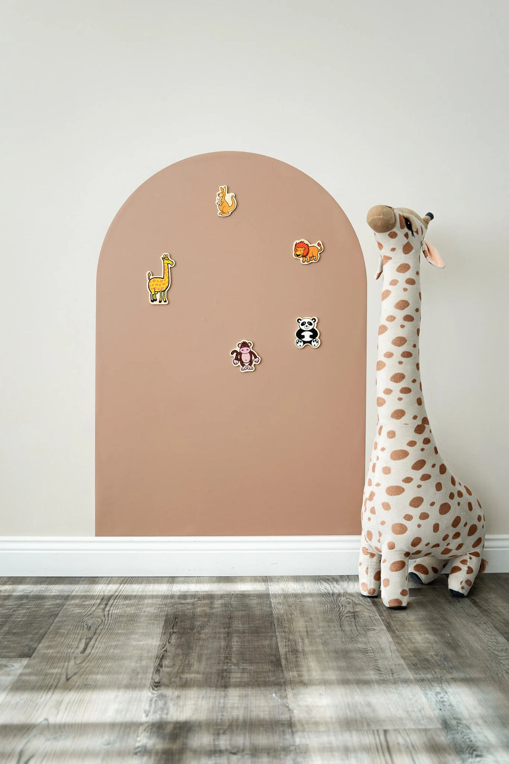 A product display of Tix&Mix brown magnetic wall decal with wooden animal toys and a giraffe toy on the side.