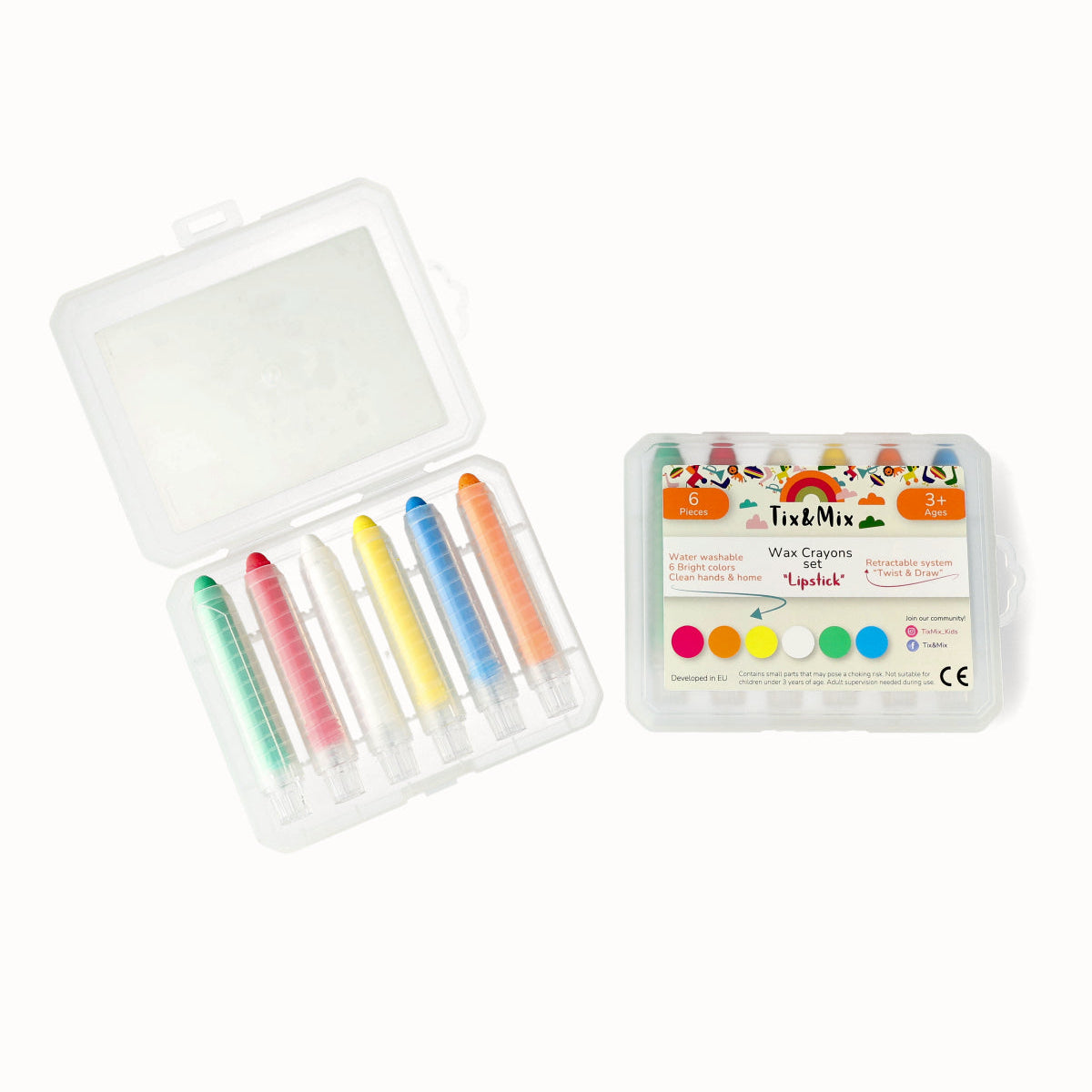 Set of colorful wax crayons in a transparent case on a white background