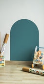 A product display of Tix&Mix magnetic wall decal in cyan wave color attached on to a clean white wall.