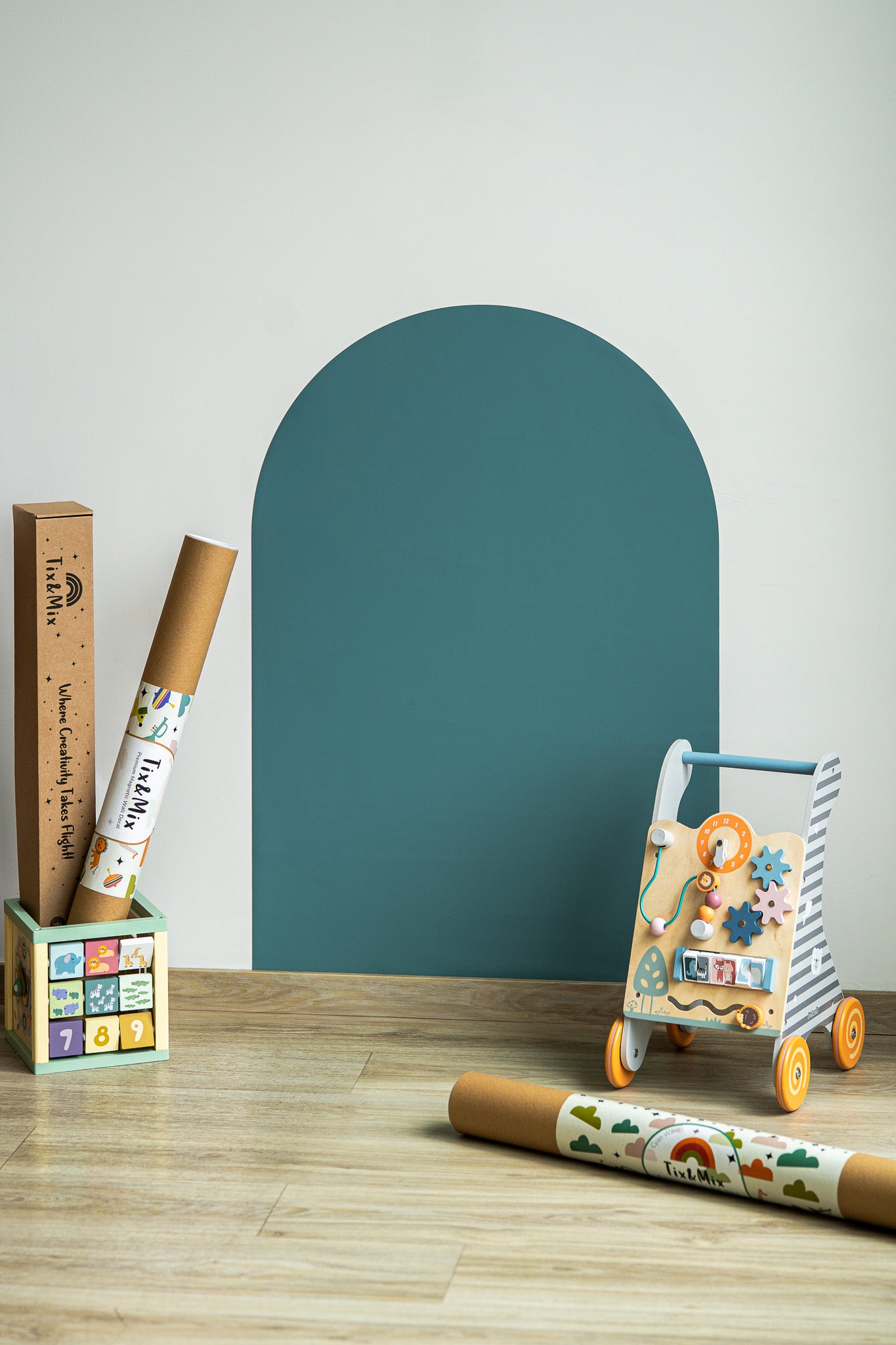 A product display of Tix&Mix magnetic wall decal in cyan wave color attached on to a clean white wall.
