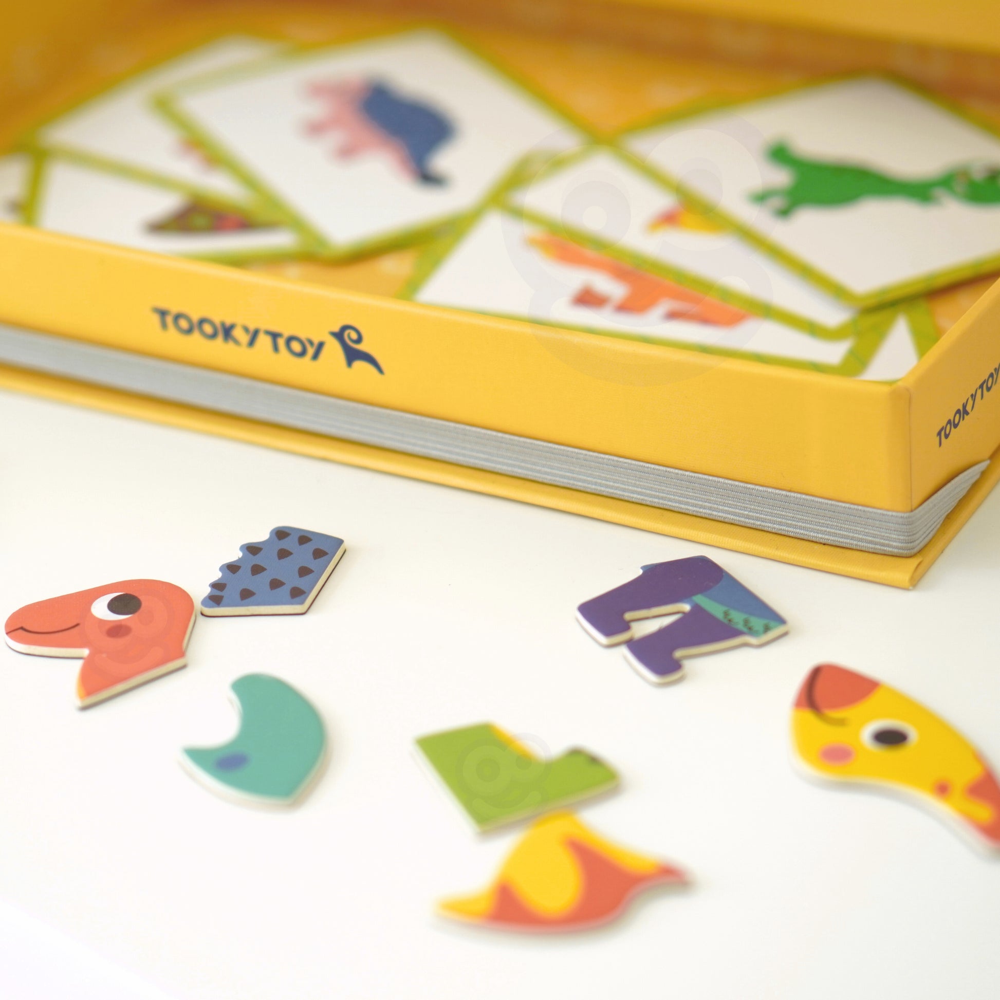 A close-up photo of Tix&Mix dinosaur puzzle set for kids.