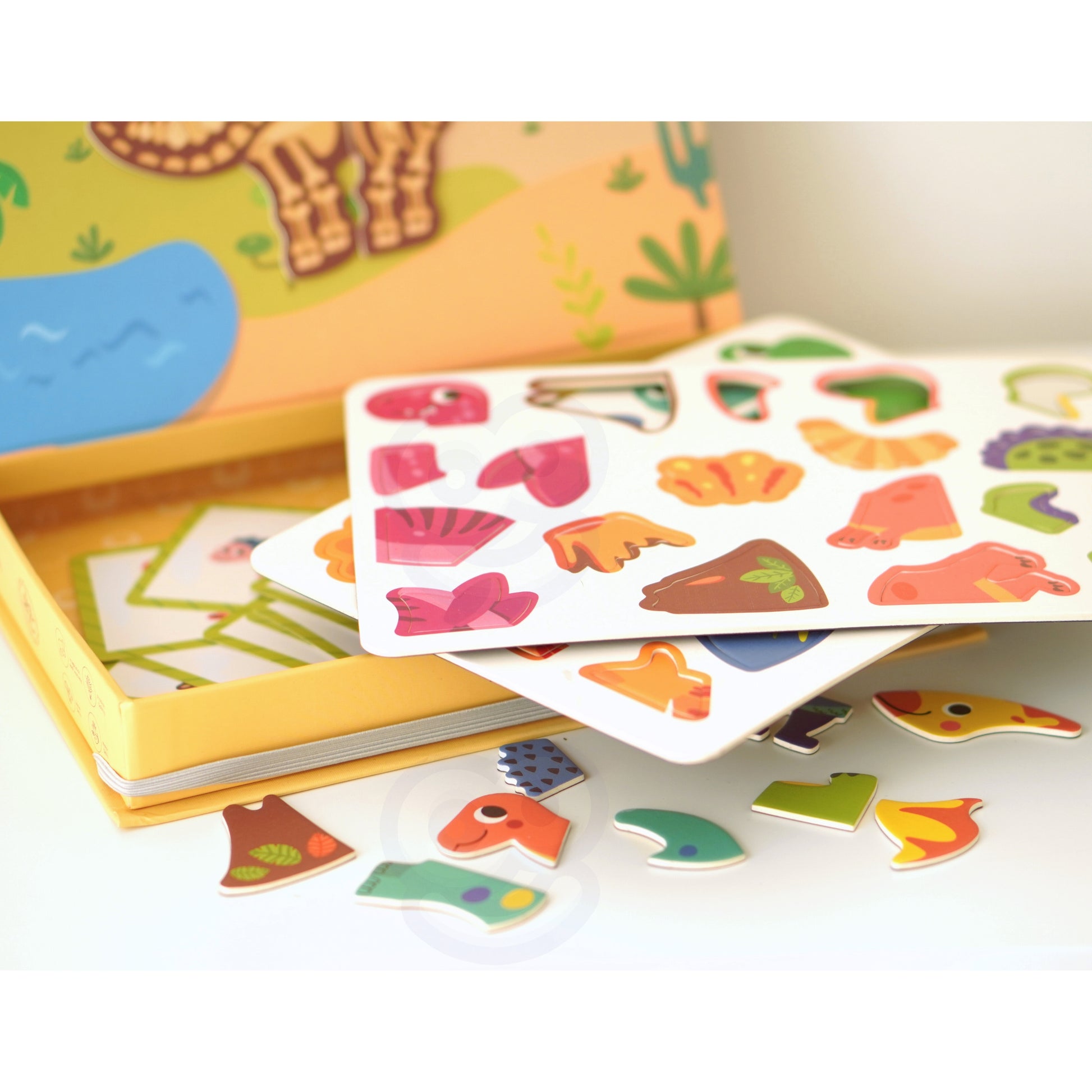 A collection of Tix&Mix dinosaur toy set in a box.