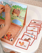 A female kid playing with Tix&Mix magnetic farm toys.