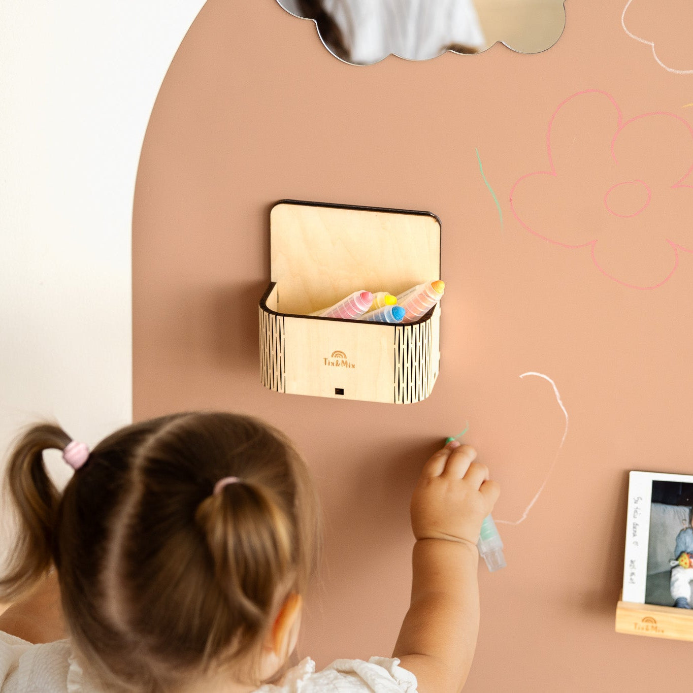 A magnetic magic box on a magnetic wall board.