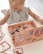 A child busy playing with Tix&Mix magnetic farm discovery set toys.