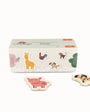 Set of animal-themed wooden puzzle pieces with a box on a white background