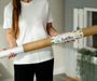 A woman holding a Tix&Mix magnetic wall decal roll.