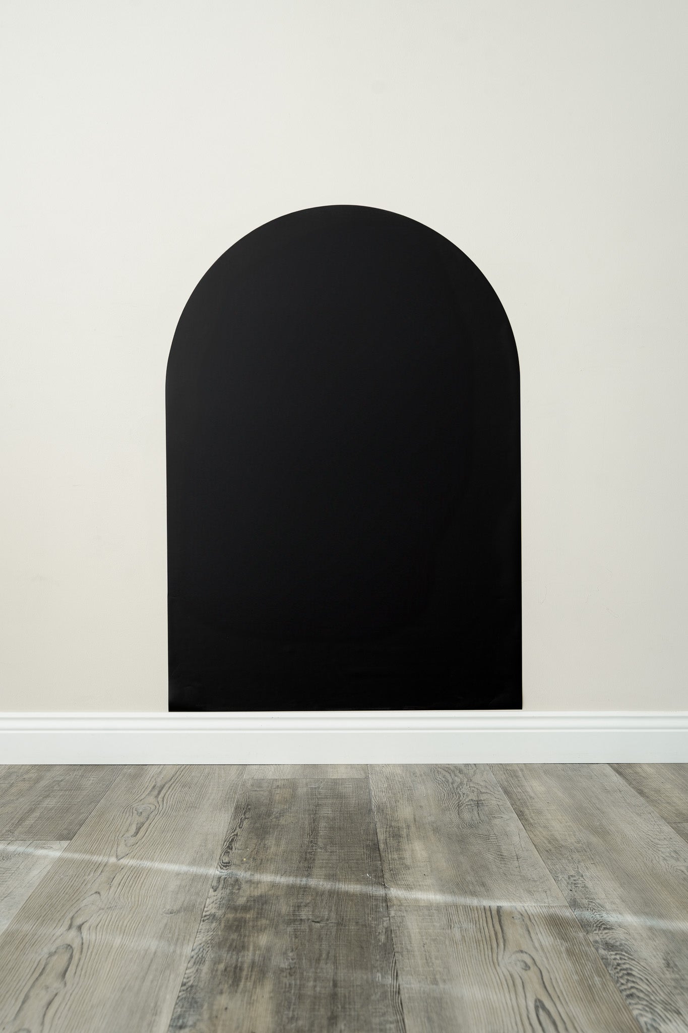 A product display of Tix&Mix black magnetic wall decal on a clean white wall.