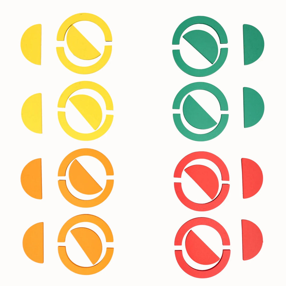 A product display of Tix&Mix rings and blocks on a white background featuring circular geometric shapes.