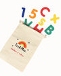 Beige pouch with colorful numbers and letters spilling out on a white background, featuring 'Tix & Mix' branding.