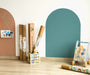 Tix&Mix magnetic wall decals displayed in a modern kids playroom with decal rolls and educational toys.