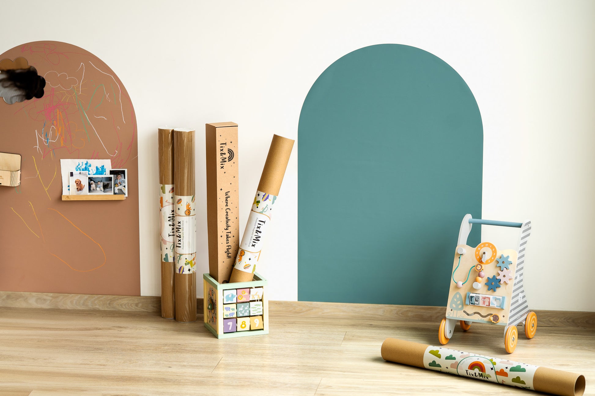 Tix&Mix magnetic wall decals displayed in a modern kids playroom with decal rolls and educational toys.
