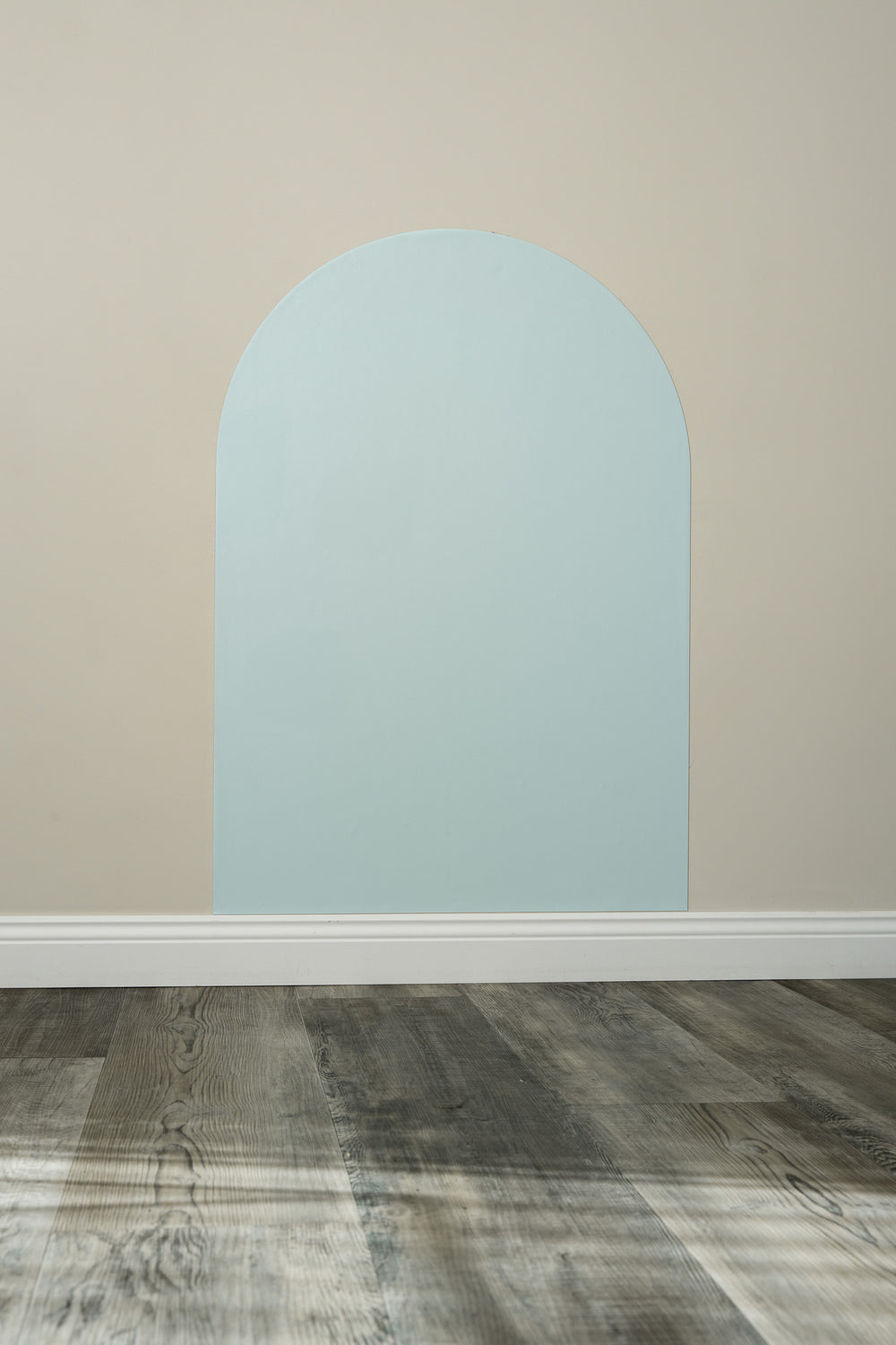 A Tix&Mix cyan blue magnetic wall decal secured on a clean wall.