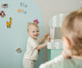 A toddler playing happily with Tix&Mix magnetic toys.