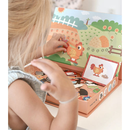 A female child playing with Tix&Mix farm discovery set toys.