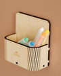 A Tix & Mix wooden magnetic box that contains crayons in different colors inside.