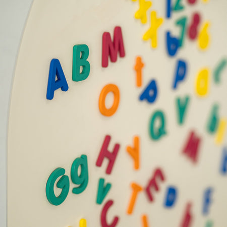 A close-up photo of Tix&Mix magnetic letter toys for kids.