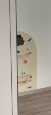 A video featuring Tix&Mix marble track on a magnetic wall decal being used by a kid and parent.